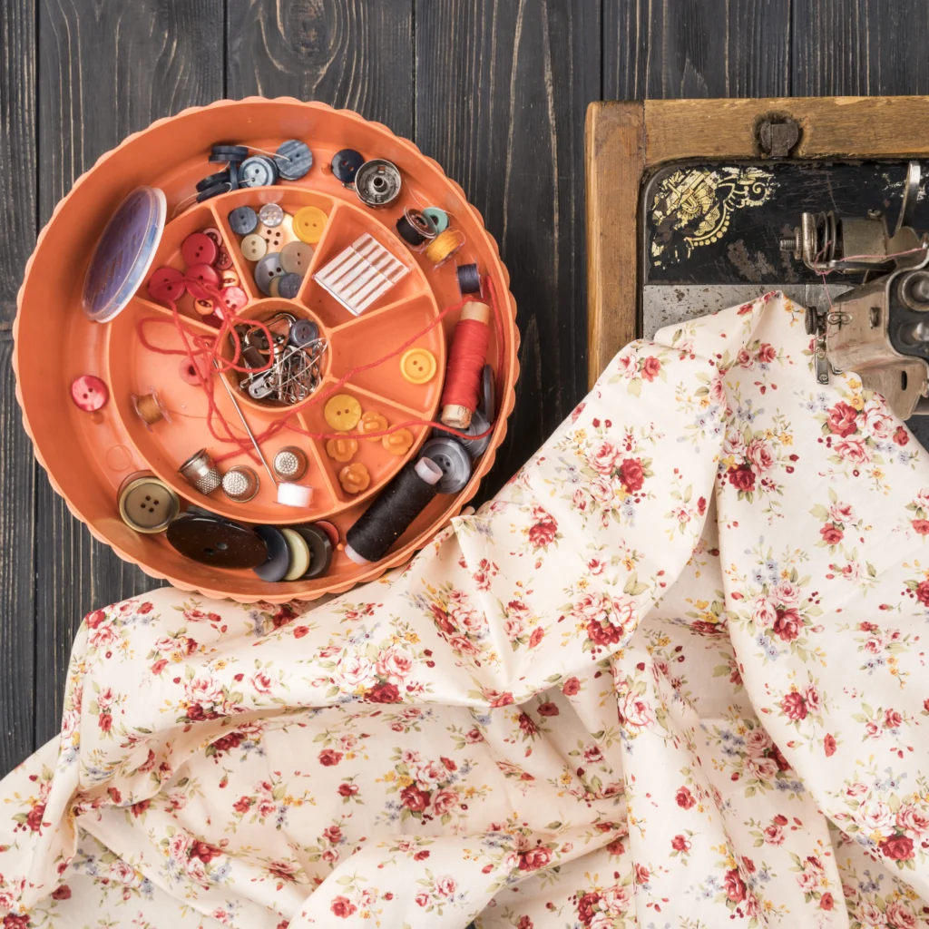 Creative Ideas for Using Fabric Decorative Accents in Your Home: Affordable Styling Guide: Decorating 101 box with sewing supplies wood table