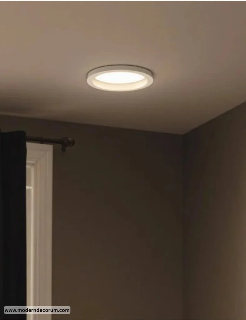 USE RECESSED LIGHTING FOR A CLEAN, MODERN LOOK Modern living room featuring sleek recessed lighting for a clean design.