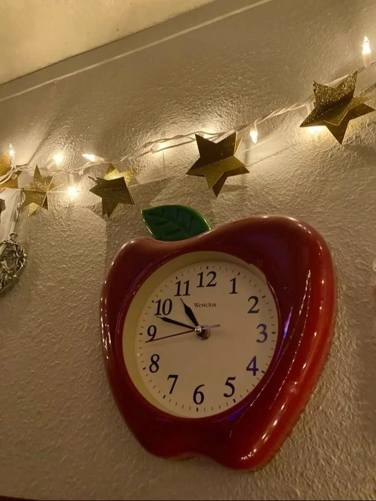 Apple Wall Clock 🍎 Stylish Apple Wall Clock in vibrant red with green leaves design.