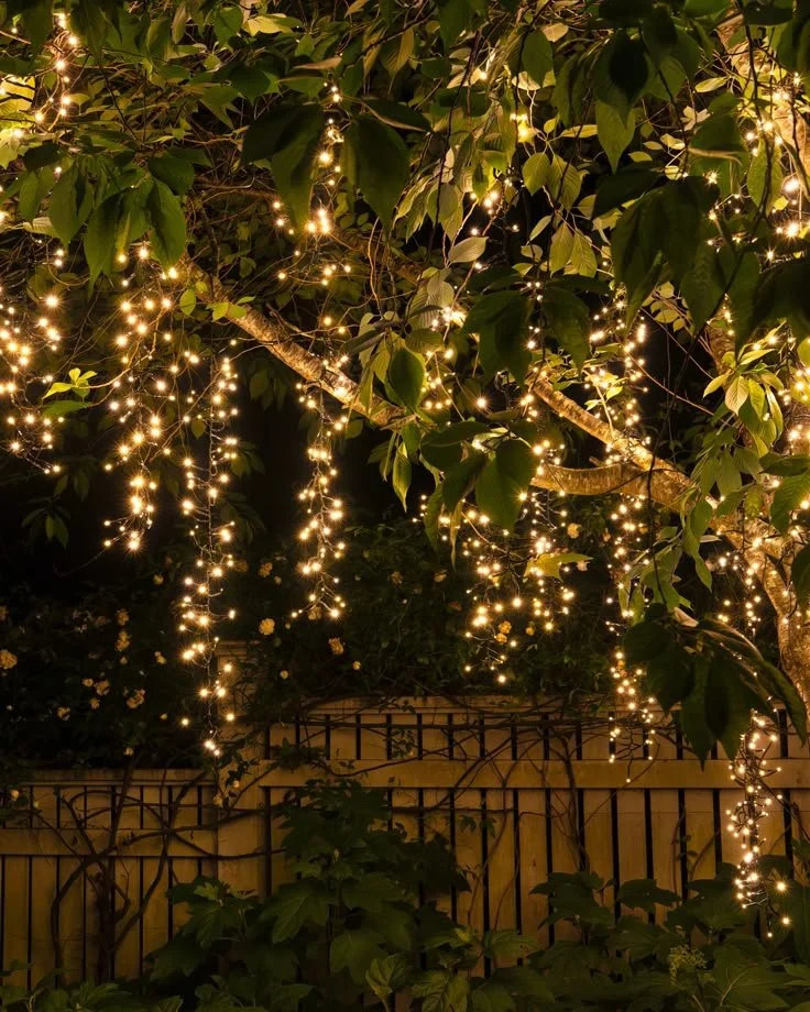 Outdoor cascade tree light string with warm white LEDs by Balsam Hill.