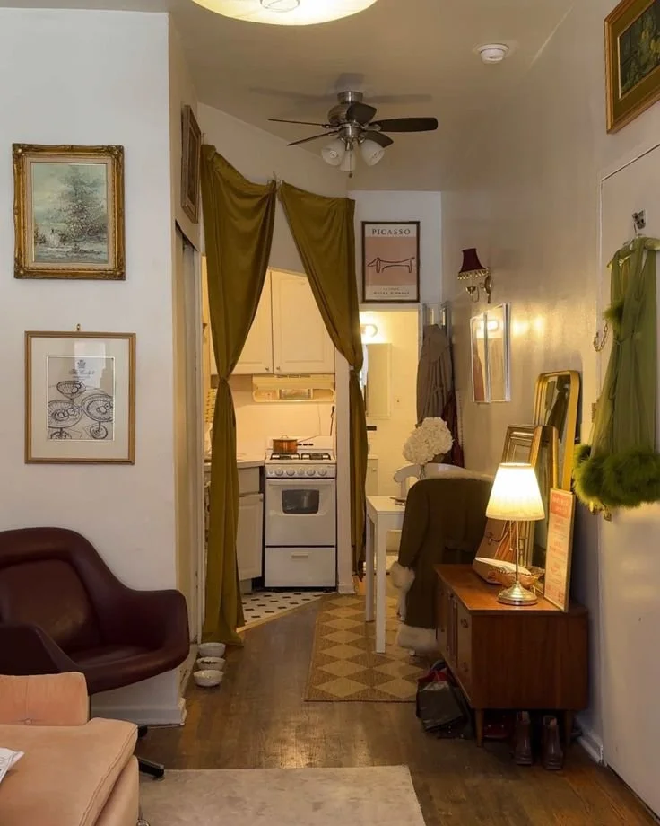 This Tiny NYC Rental Is the Perfect Combo of “1960s Meets 2000s NYC Rom-com” Cozy NYC rental showcasing 1960s and 2000s design elements.