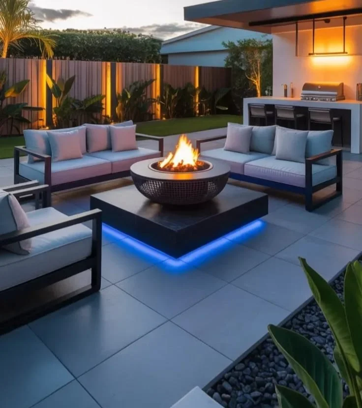 Modern back patio ideas with fire pit and BBQ kitchen for outdoor living in 2026.