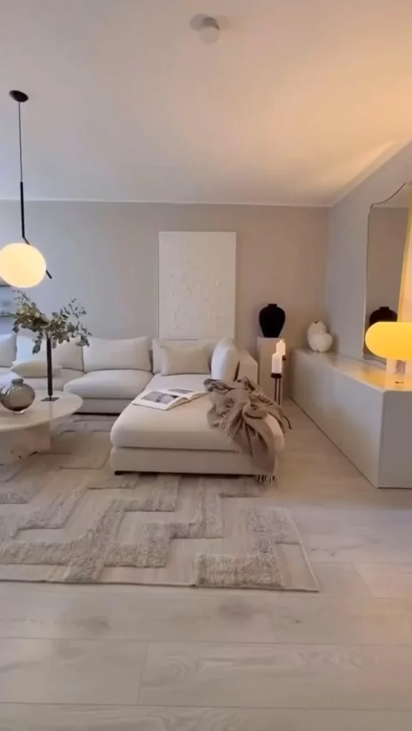 Cozy living room featuring a luxurious mirror wall design for aesthetic appeal.