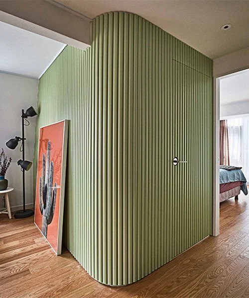 Curved Wall Room: Green & Wood Vibes Curved wall room featuring green decor and wooden accents for a nature-inspired vibe.