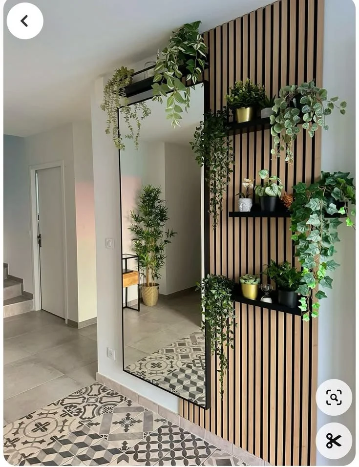 Chic mirror wall planter setup enhancing entrance decor