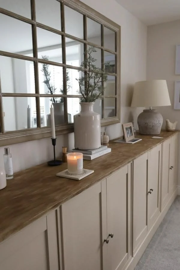 Reflective storage unit in a cozy living room setting